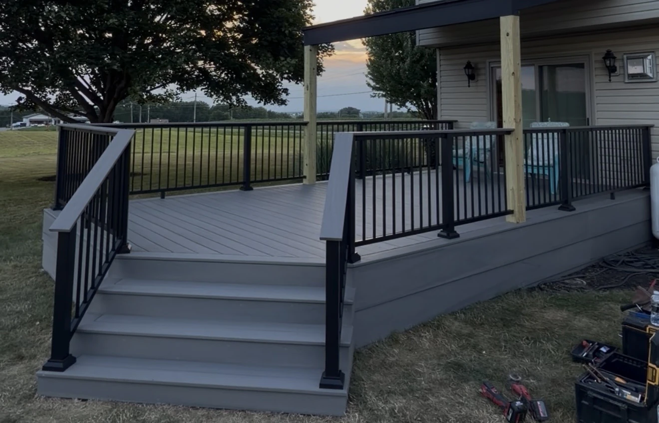 Grey composite deck with black aluminium railings and steps