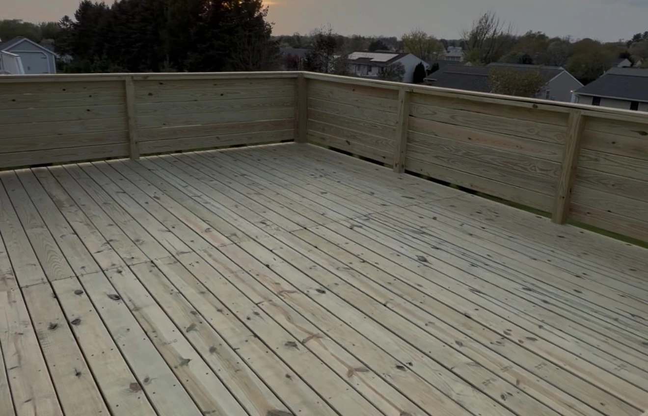Large timber deck with a solid privacy wall